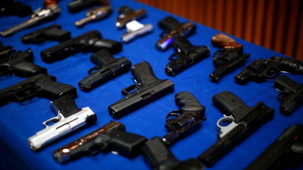 Seized guns are pictured at the police headquarters in New York, N.Y., Aug. 19, 2013.
