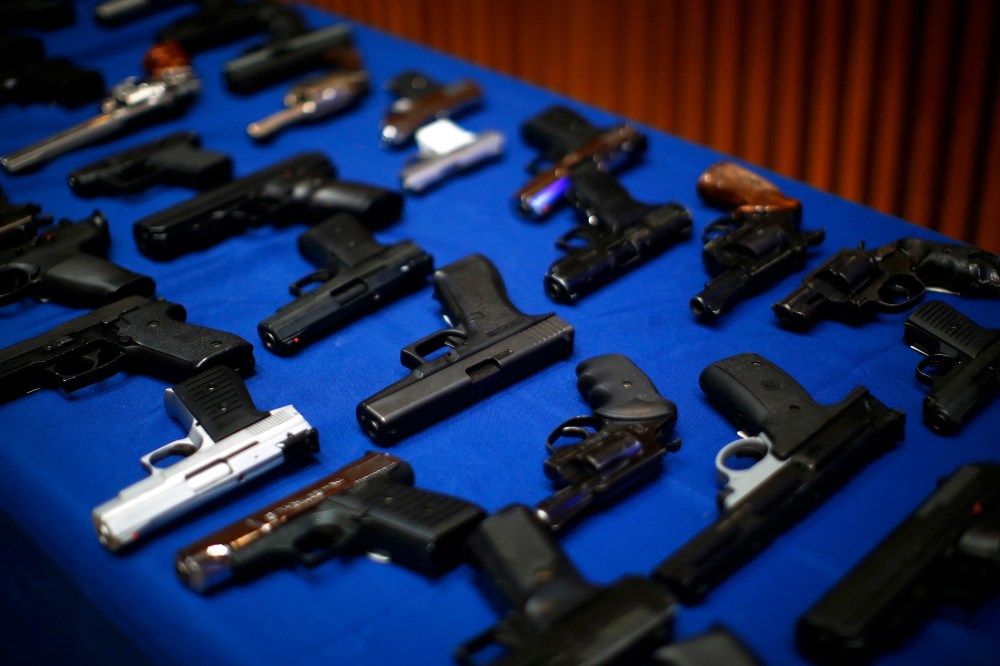 Seized guns are pictured at the police headquarters in New York, N.Y., Aug. 19, 2013.
