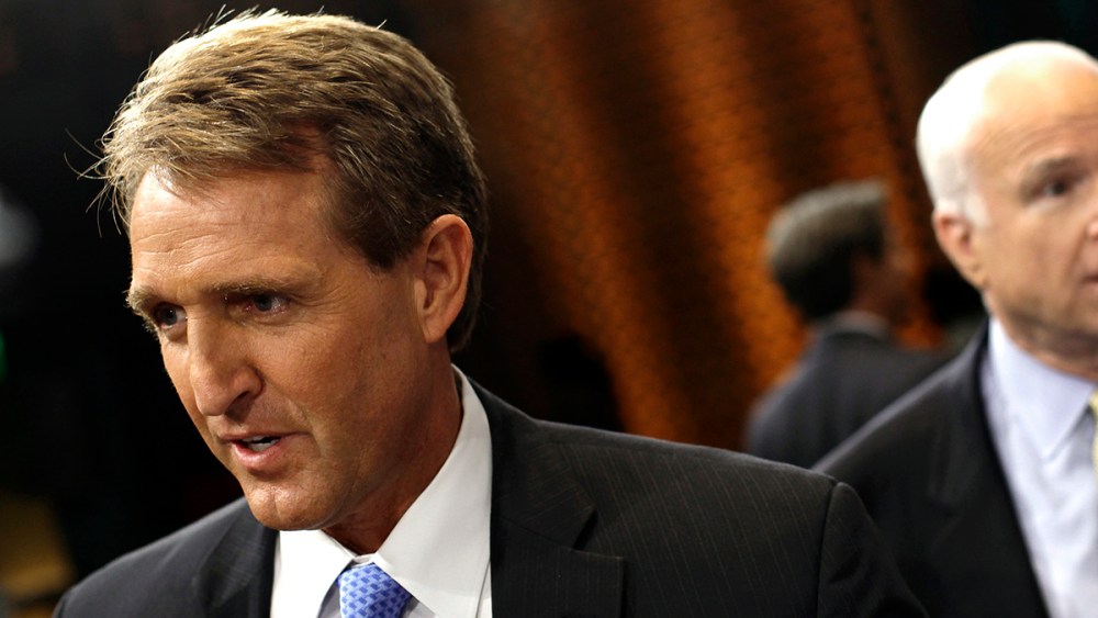 U.S. Senator Jeff Flake (R-AZ) (L) and U.S. Senator John McCain (R-AZ) speak to reporters after attending a "Conversation On Immigration" during a town hall event in Mesa