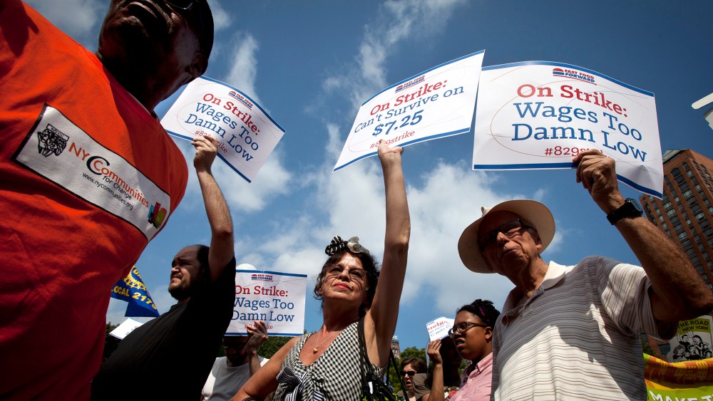 Mira Furman (C) joins with fast food workers to protest the minimum wage in New York on Aug. 29, 2013.