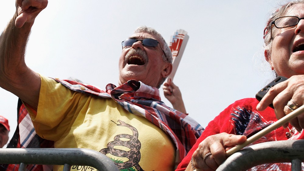 A man gives a thumbs-down to Obamacare at the Tea Party Patriots 'Exempt America from Obamacare' rally on the west lawn of the U.S. Capitol in Washington