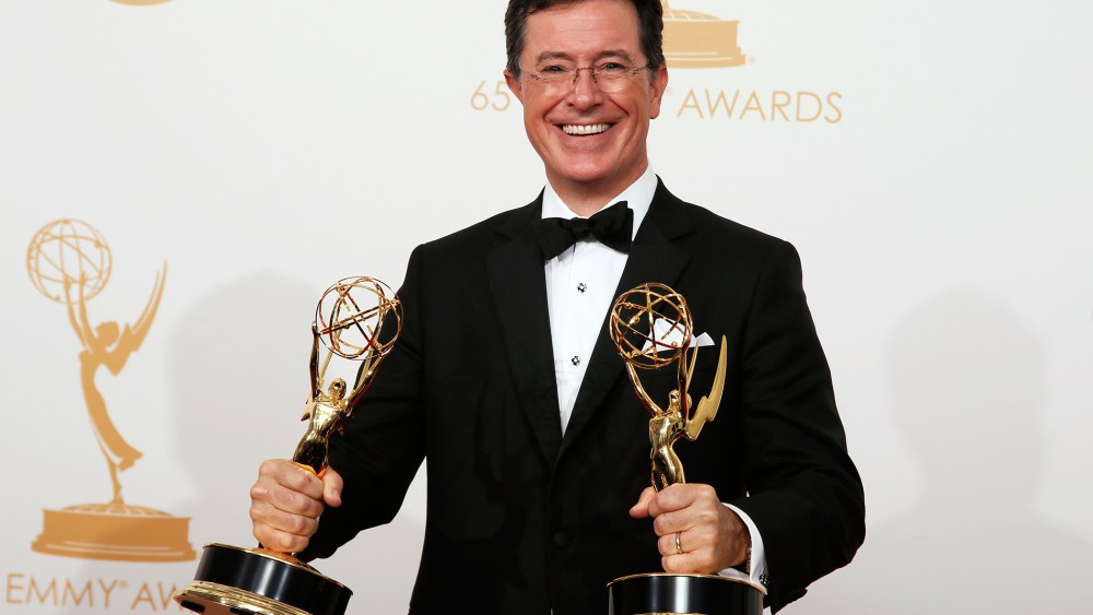 Stephen Colbert poses backstage with his awards for Outstanding Variety Series and Outstanding Writing For A Variety Series at the 65th Primetime Emmy Awards in Los Angeles, Calif., Sept. 22, 2013.
