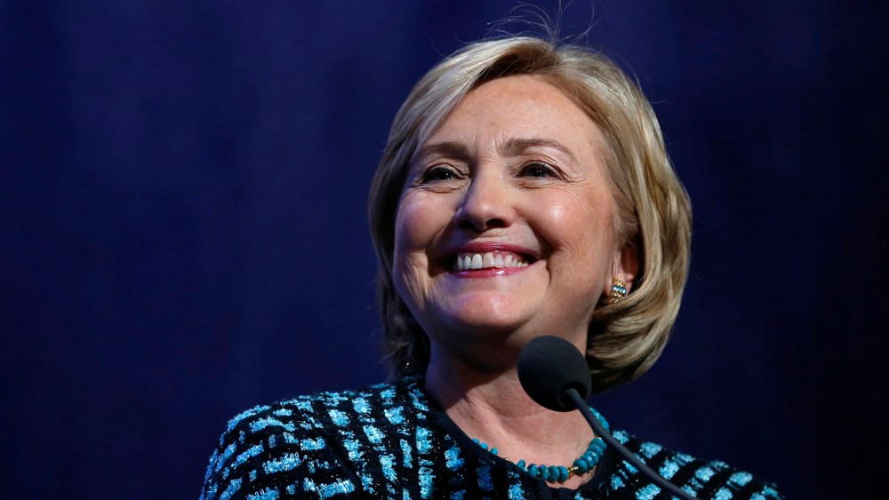Hillary Clinton smiles as she introduces former U.S. President Bill Clinton and U.S. President Barack Obama to discuss healthcare reform at the Clinton Global Initiative in New York September 24, 2013.