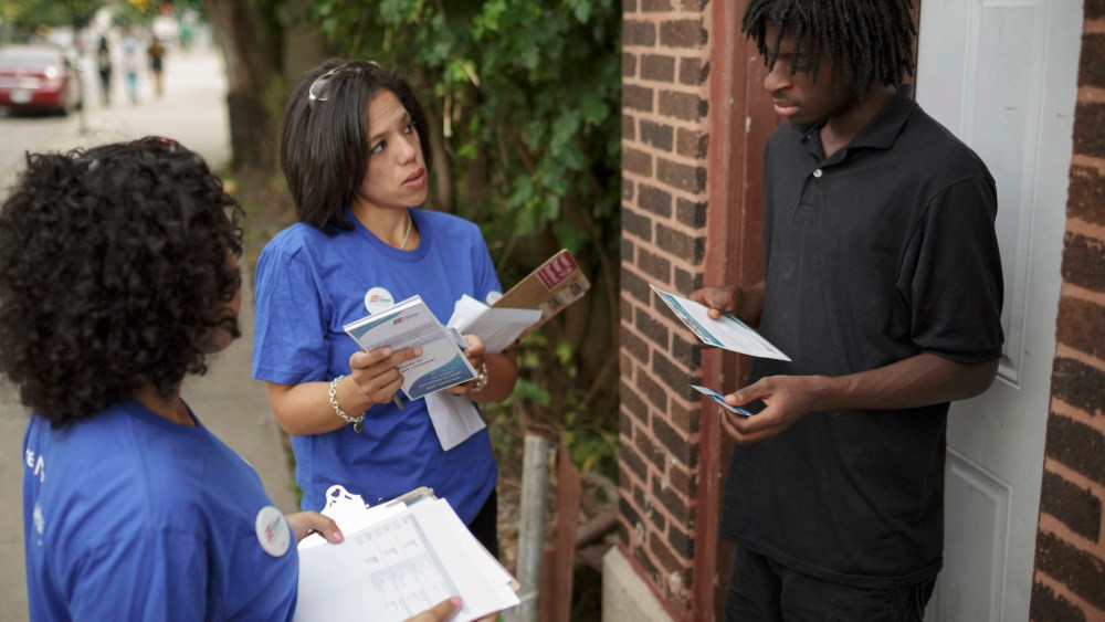 Get Covered America volunteers Cynae Derose and Jalisa Hinkle talk with Daniel Glover about the Affordable Care Act - also known as Obamacare - while canvassing a Chicago neighborhood