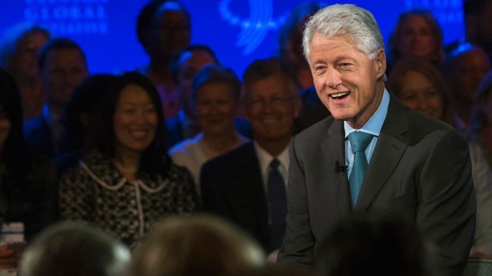 Former U.S. President Bill Clinton (R) laughs during an interview at the Clinton Global Initiative (CGI) in New York September 25, 2013.