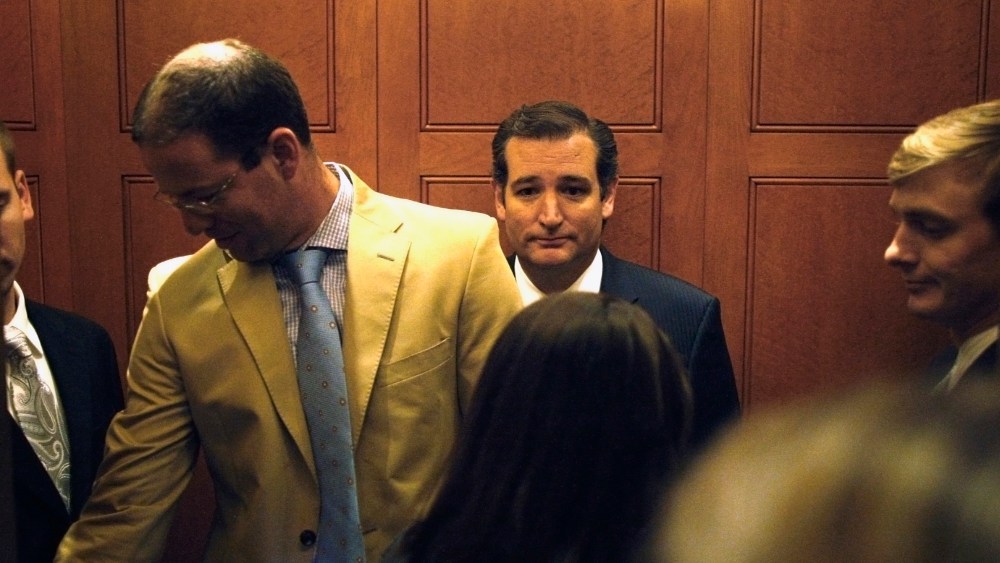 U.S. Senator Cruz departs in an elevator after speaking to reporters about his opposition after the Senate passed a spending bill to avoid a government shutdown at the U.S. Capitol in Washington
