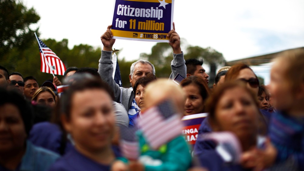Hundreds of protesters calling for comprehensive immigration reform gather at a rally on the Washington Mall, October 8, 2013.