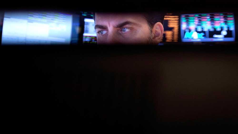 Trader checks his screens on the floor of the New York Stock Exchange in New York