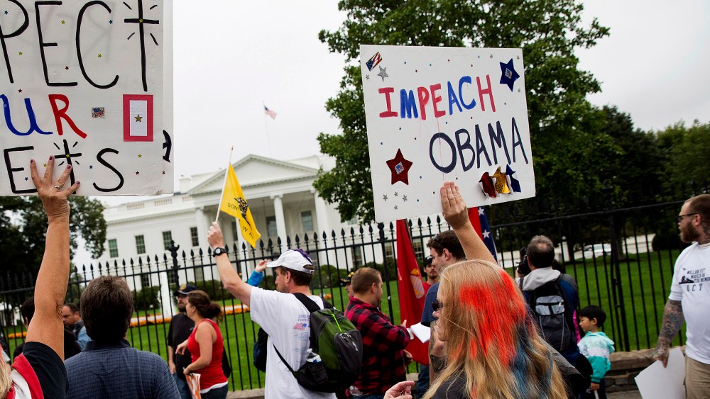 Protesters with the "Million Vet March on the Memorials" call for impeachment of U.S. President Barack Obama in front of the White House in Washington on Oct. 13, 2013.