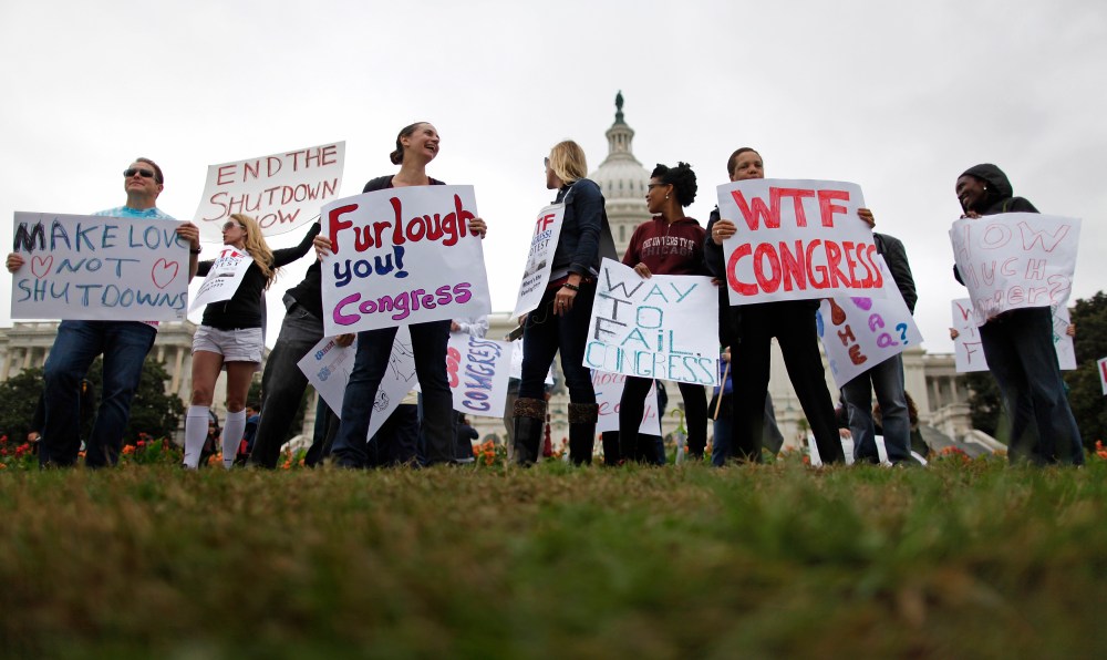 Federal workers demonstrate for an end to the U.S. government shutdown on the west front of the U.S. Capitol in Washington, October 13, 2013.