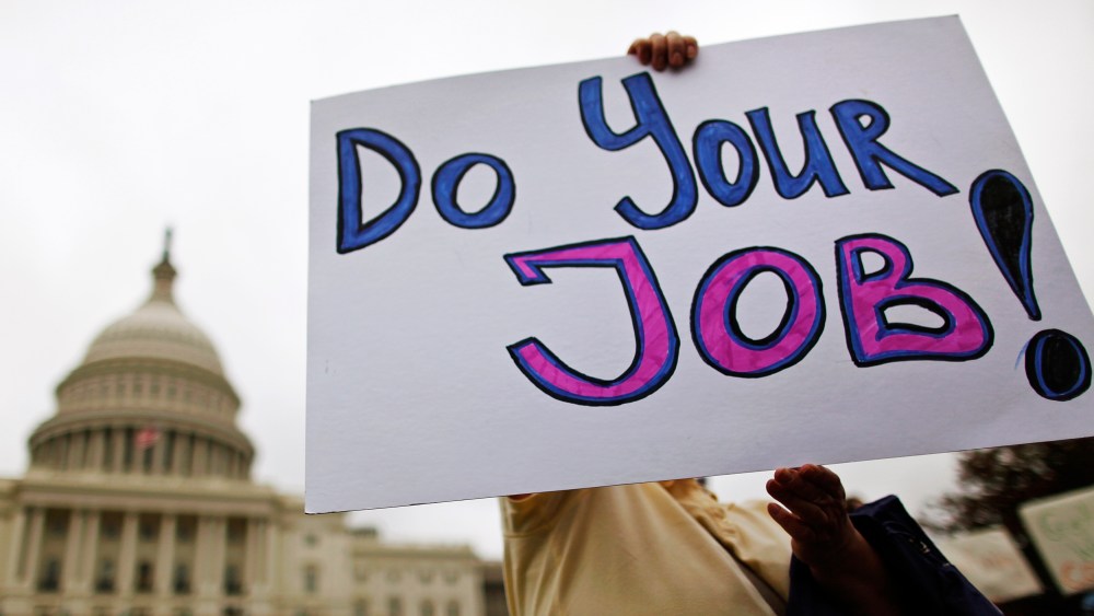 Federal workers demonstrate for an end to the U.S. government shutdown on the west front of the U.S. Capitol in Washington on October 13, 2013.