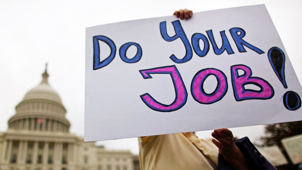 Federal workers demonstrate for an end to the U.S. government shutdown on the west front of the U.S. Capitol in Washington, October 13, 2013.