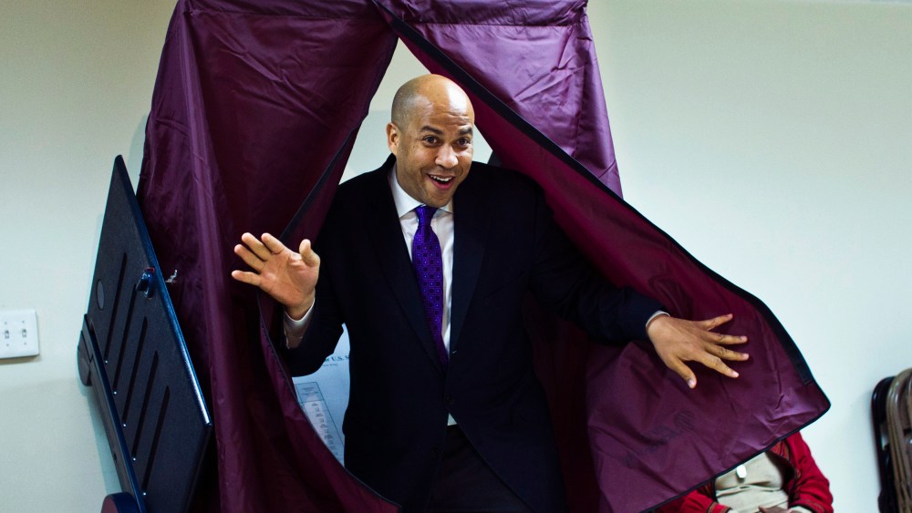 Newark Mayor and U.S. Senate candidate Cory Booker leaves a polling station after casting his ballot during the Senate primary election in Newark, New Jersey, October 16, 2013.