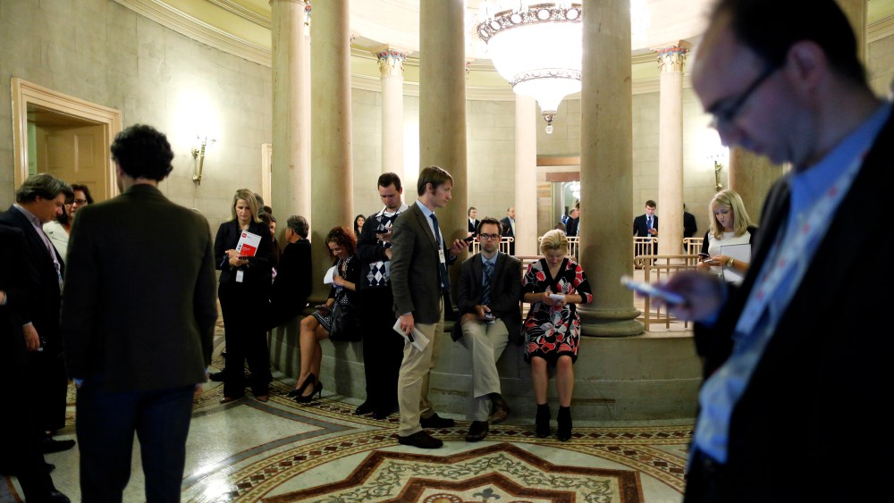 Reporters gather outside of a Republican Senate caucus meeting and wait for senators' remarks at the U.S. Capitol in Washington October 16, 2013.
