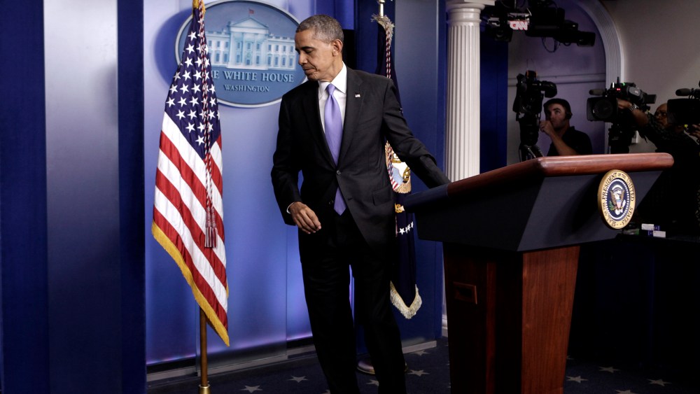 U.S. President Barack Obama leaves the briefing room of the White House in Washington on Oct. 16, 2013.