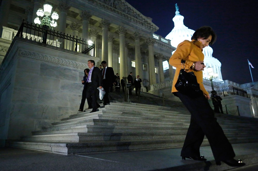 Members of the U.S. House of Representatives depart after a late-night vote on fiscal legislation to end the government shutdown, at the U.S. Capitol in Washington, October 16, 2013.