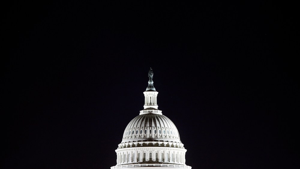 The U.S. Capitol dome in the pre-dawn darkness in Washington D.C.