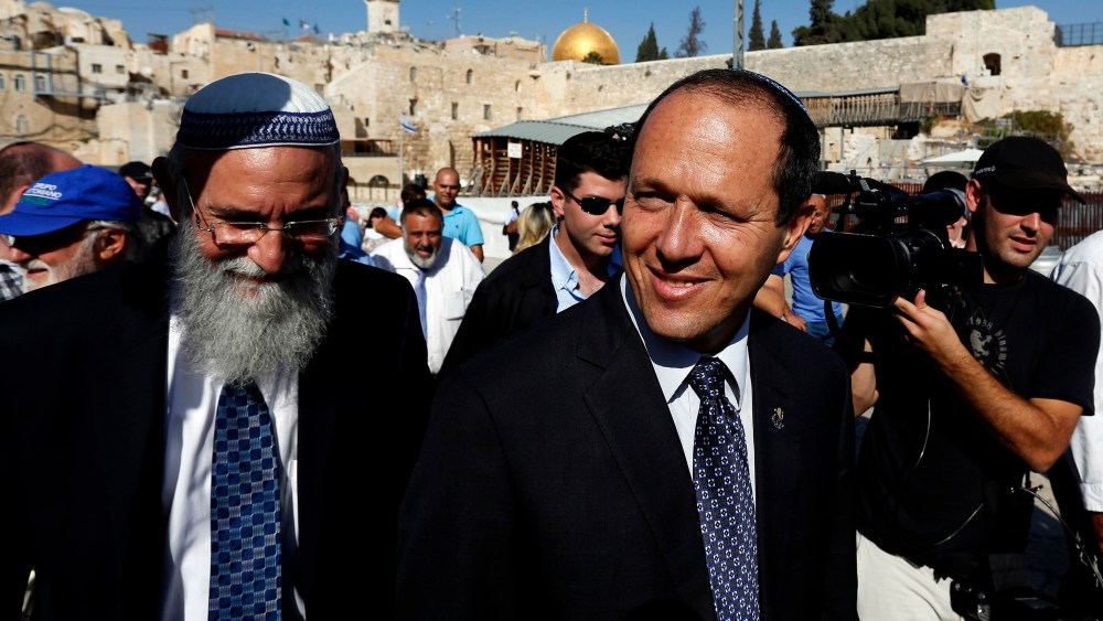 Jerusalem Mayor Nir Barkat walks after praying at the Western Wall in Jerusalem's Old City Oct. 23, 2013. (Photo by Baz Ratner/Reuters)
