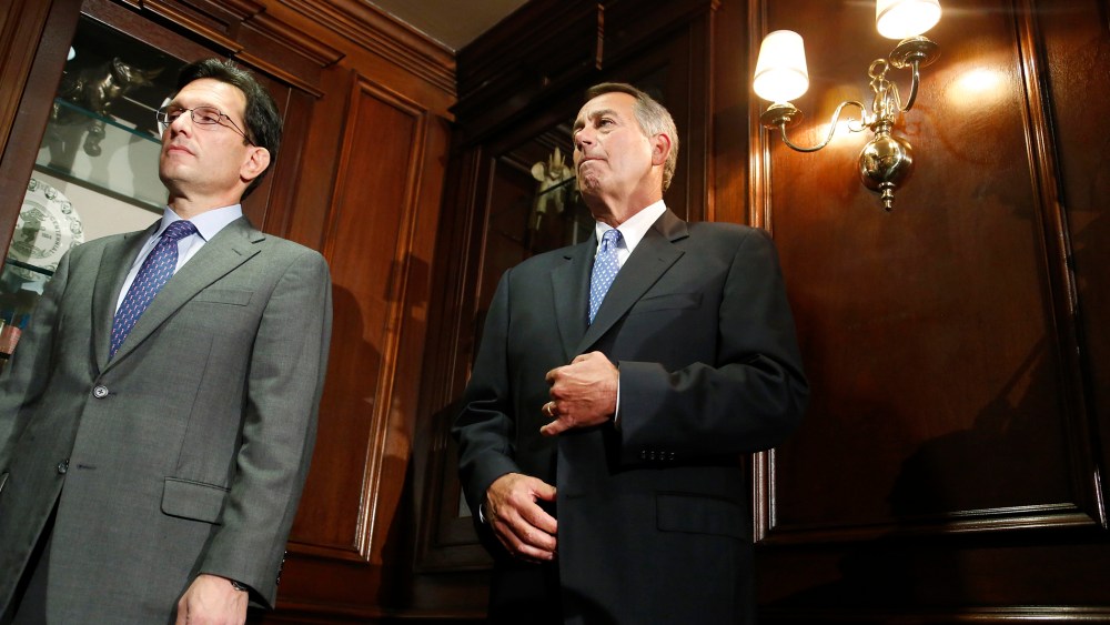 U.S. House Majority Leader Eric Cantor (R-VA) (L) and House Speaker John Boehner (R-OH) (R) stand together at a news conference, Oct. 23, 2013, in Washington.