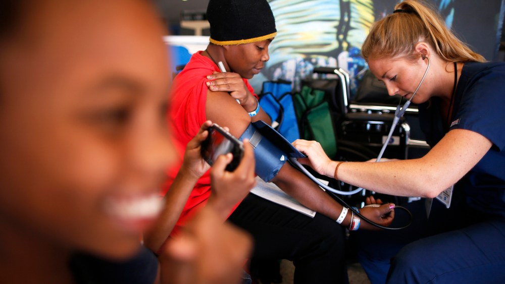 Patricia Broaster has her blood pressure measured at Care Harbor LA, a free medical clinic in Los Angeles, Oct. 31, 2013.