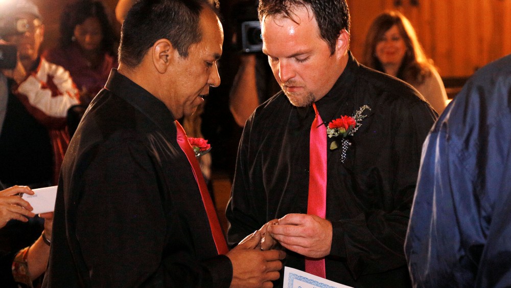 Darren Black Bear and Jason Pickel exchange rings they are married in El Reno, Oklahoma, Oct, 31, 2013.