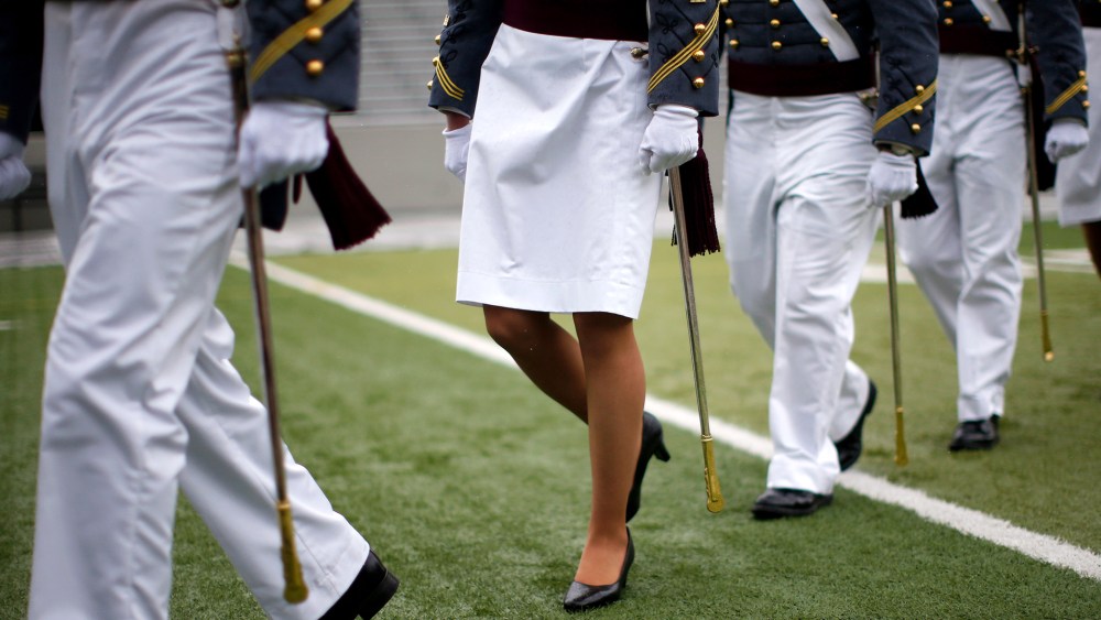 A female cadet marches with other cadets for their graduation ceremony on May 24, 2013.
