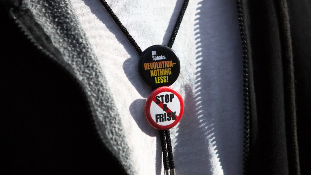Noche Diaz wears badges at a news conference against the Stop-and-Frisk program, outside the Federal Court in New York November 1, 2013.