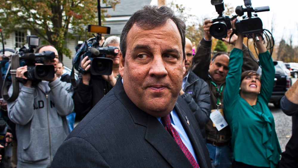 New Jersey Governor Chris Christie speaks with media after casting his vote, November 5, 2013.