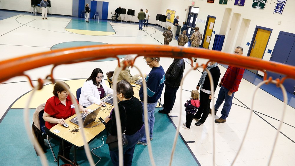 Voters check in to vote at a polling place in Spotsylvania, Virginia, Nov. 5, 2013.