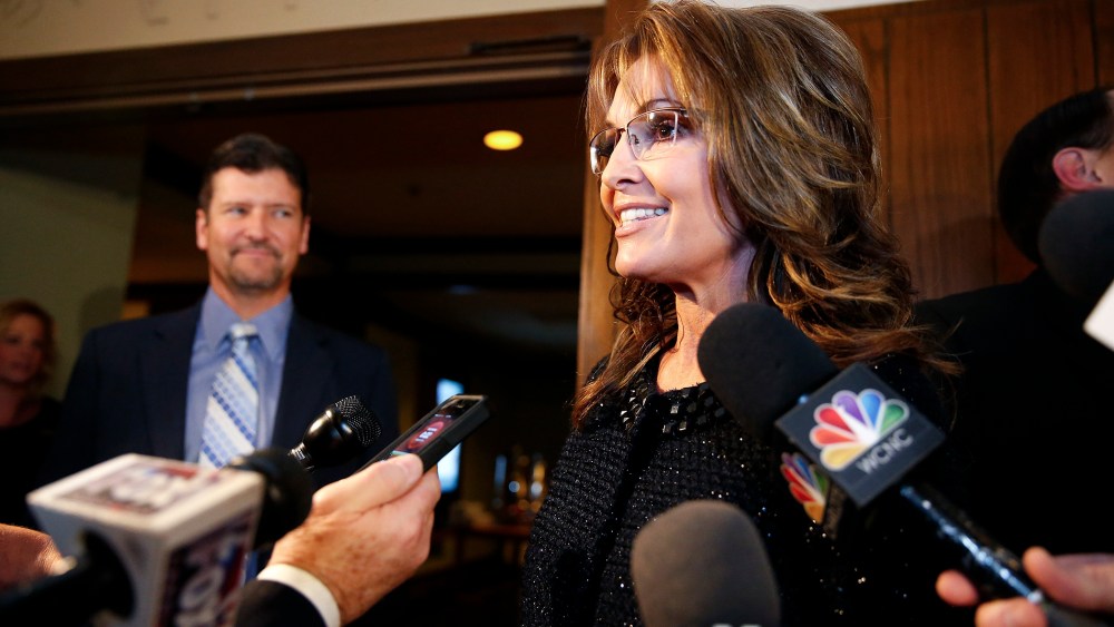 Sarah Palin speaks to members of the media before a celebration for evangelist Billy Graham's 95th birthday in Asheville