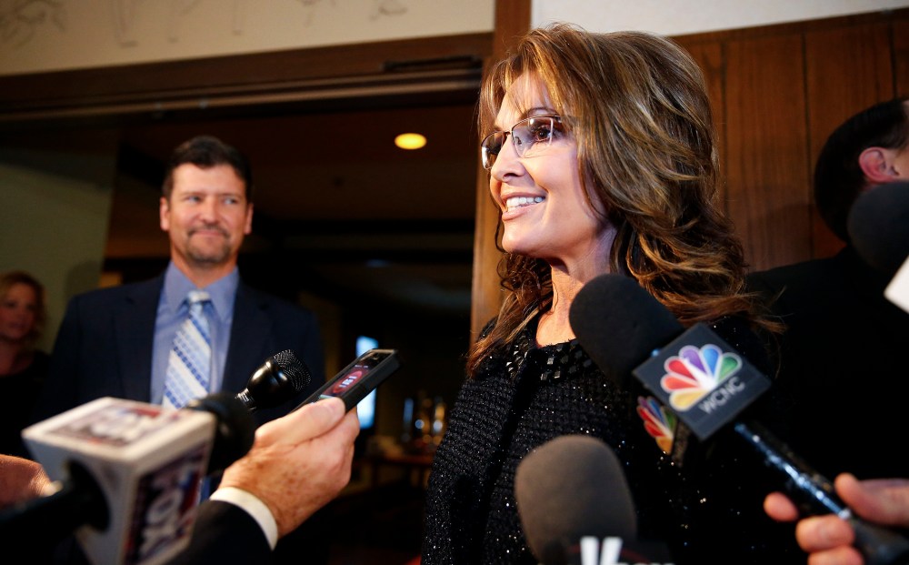 Sarah Palin speaks to members of the media before a celebration for evangelist Billy Graham's 95th birthday in Asheville