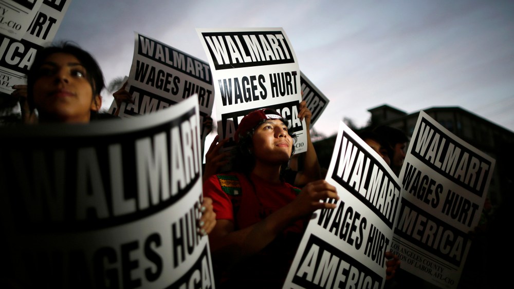 Pedro Taverna, 18, takes part in a protest for better wages outside Wal-mart in Los Angeles on Nov. 7, 2013.