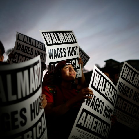 Pedro Taverna takes part in a protest for better wages at which 54 people were arrested outside Wal-mart in Los Angeles