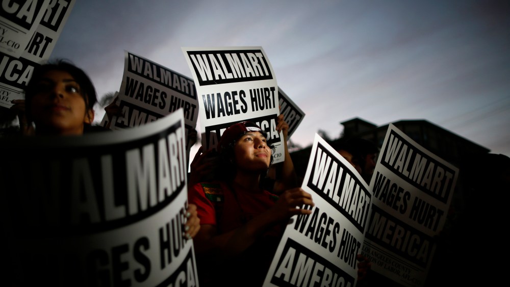 Pedro Taverna takes part in a protest for better wages at which 54 people were arrested outside Wal-mart in Los Angeles
