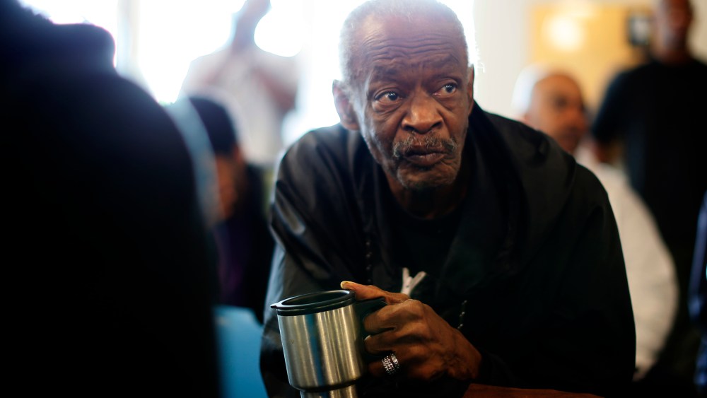 U.S. military veterans listen to speeches during a Veterans Day observance for homeless veterans at The Midnight Mission shelter on skid row in Los Angeles.