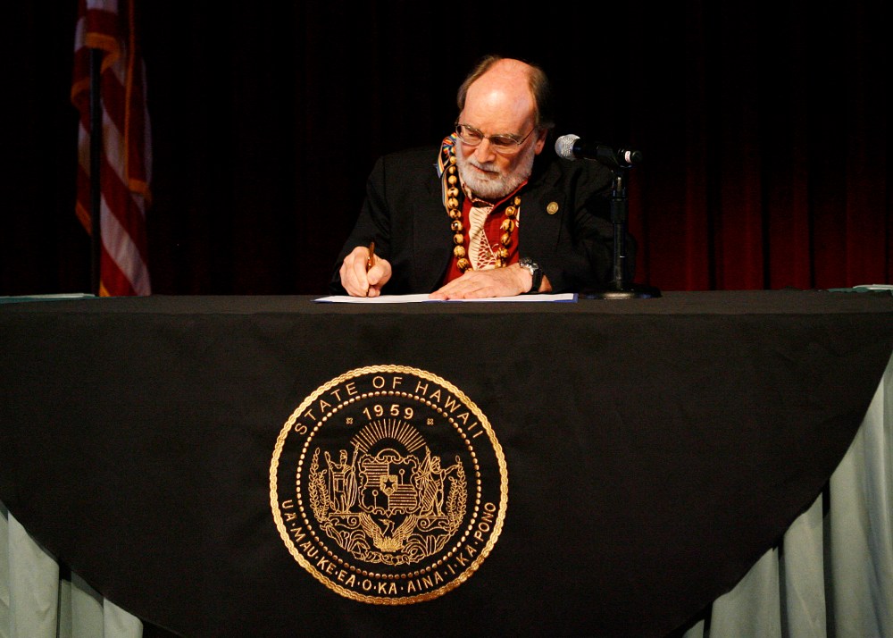 Governor Neil Abercrombie signs a bill allowing same sex marriage to be legal in Hawaii, Nov. 13, 2013.