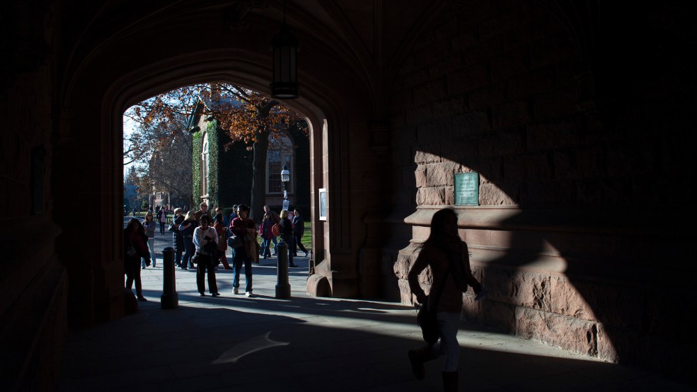 People walk around the Princeton University campus in New Jersey, Nov. 16, 2013.