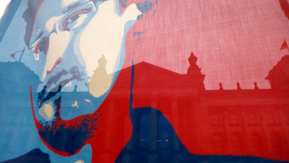 A flag depicting fugitive former U.S. National Security Agency contractor Edward Snowden, during a demonstration.