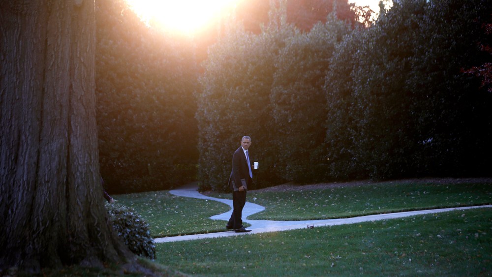 U.S. President Barack Obama walks to the Oval Office of the White House on November 19, 2013.