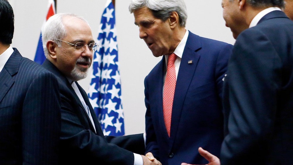 Secretary of State John Kerry (R) shakes hands with Iranian Foreign Minister Mohammad Javad Zarif after a ceremony at the United Nations in Geneva on Nov. 24, 2013.