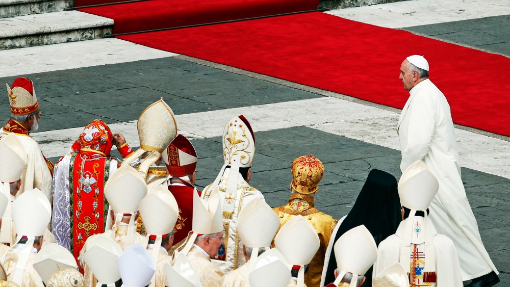 Pope Francis walks away at the end of a mass at the Vatican, Nov. 24, 2013.