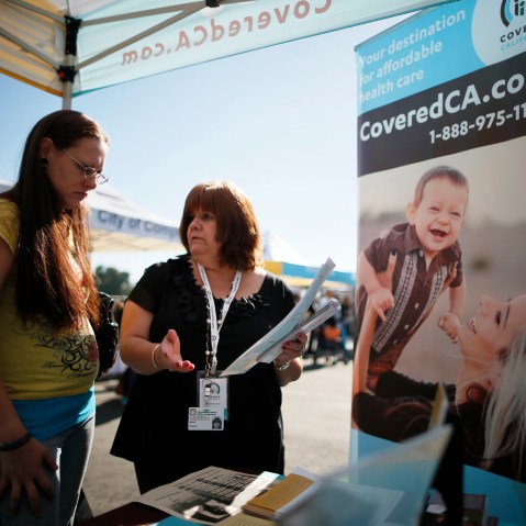 Maria Franco explains a health insurance plan to Violet Lucas-Barajas, 28, at an event to inform people about the Affordable Care Act in Los Angeles, Calif. Nov. 25, 2013.