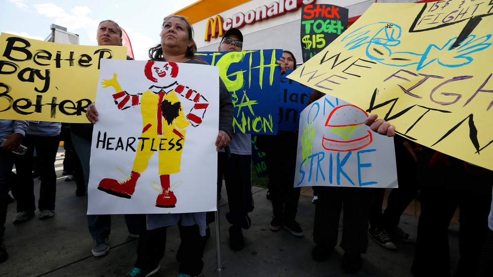 Protesters gather outside McDonald's in Los Angeles, California, December 5, 2013.
