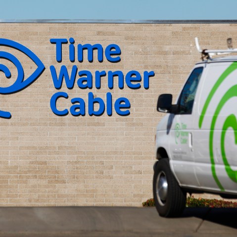 A cable truck returns to a Time Warner Cable office in San Diego, Calif. on Dec. 11, 2013. (Photo by Mike Blake/Reuters)