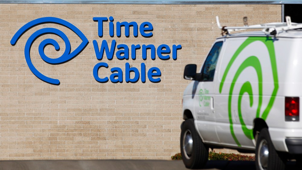 A cable truck returns to a Time Warner Cable office in San Diego, Calif. on Dec. 11, 2013. (Photo by Mike Blake/Reuters)