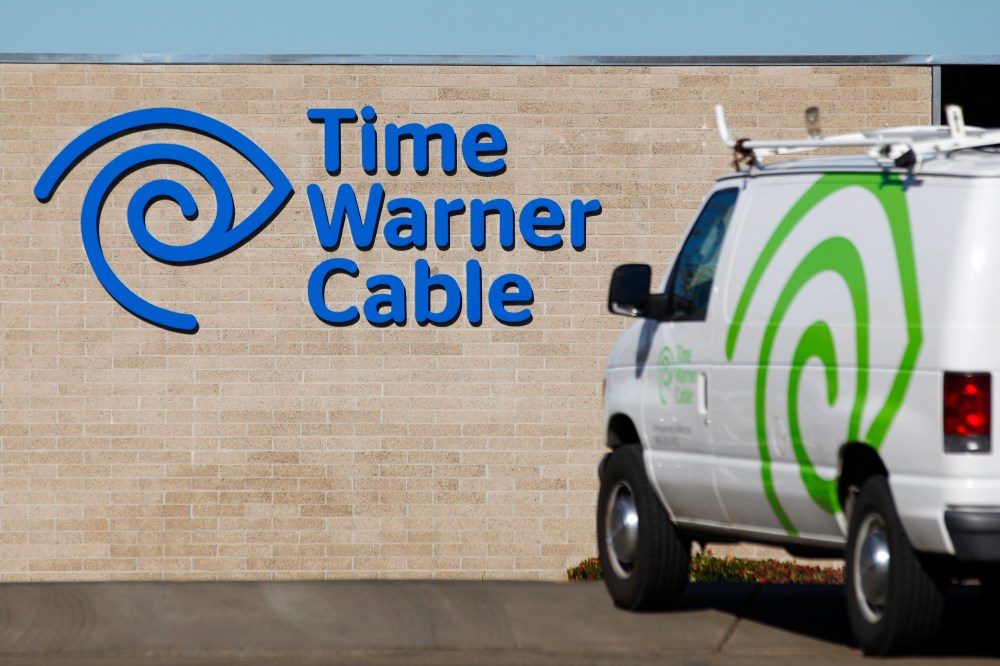 A cable truck returns to a Time Warner Cable office in San Diego, Calif. on Dec. 11, 2013. (Photo by Mike Blake/Reuters)