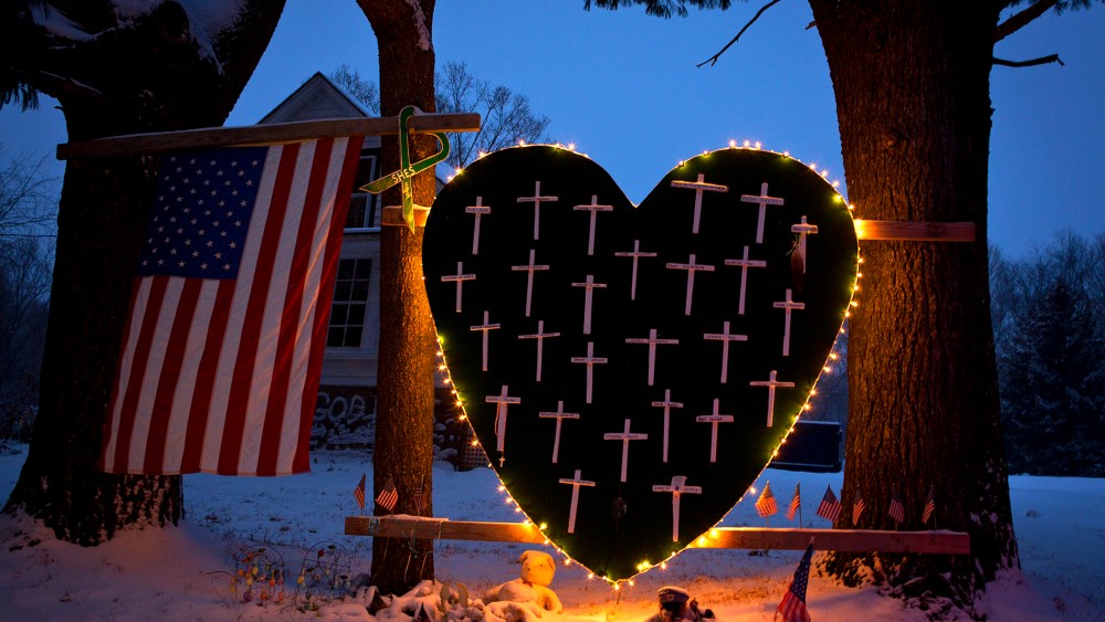 A heart that bears 26 crosses for each victim is surrounded by lights the Sandy Hook portion of Newtown, Connecticut Dec. 14, 2013.