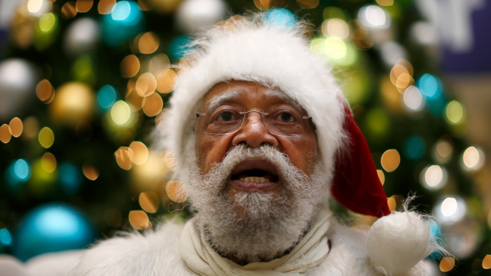African American Santa Claus Langston Patterson, 77, waits for children to arrive at Baldwin Hills Crenshaw Plaza mall in Los Angeles, Dec. 16, 2013.