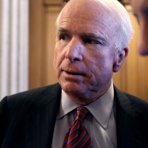 U.S. Senator McCain talks to reporters after a Senate cloture vote on budget bill on Capitol Hill in Washington