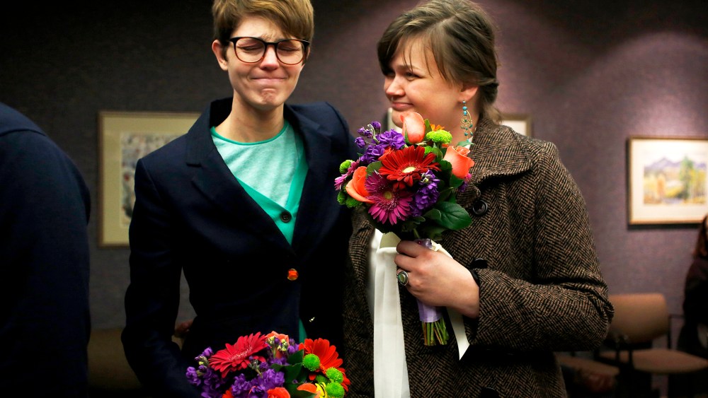 Natalie Dicou and her partner Nicole Christensen wait to get married at the Salt Lake County Clerks office, Dec. 20, 2013.